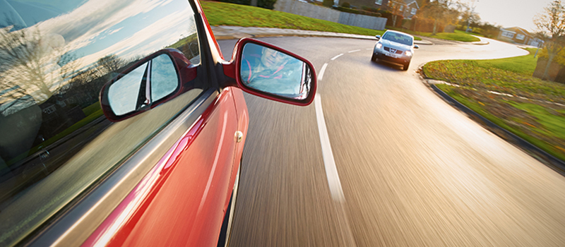 Wing mirror on a car out on the road